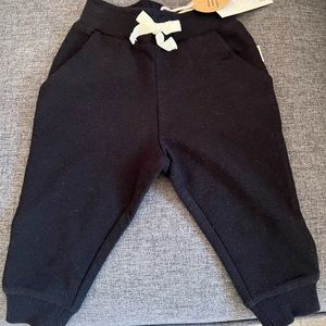 NWT - Greige - baby black bamboo track pants. Size 9-12 months